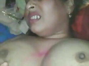 Indian aunty aroused by thoughts of her future son-in-law indulges in steamy solo play, showcasing her voluptuous figure and insatiable desires.